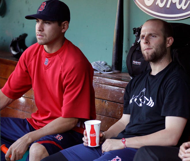 Red Sox second baseman Dustin Pedroia, right, sits with outfielder Jacoby Ellsbury, left, during batting practice prior to facing the Blue Jays yesterday.