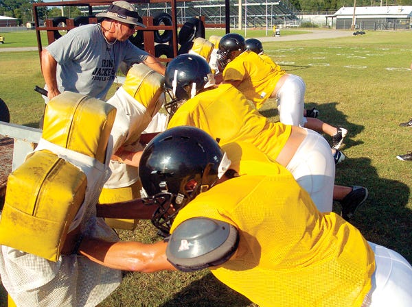 Glencoe players run blocking drills under the direction of assistant coach Wes Weems during a recent practice.