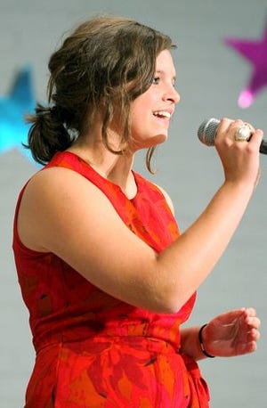 EJ Hersom/Staff photographer Meredith Eib of Kingston sings in the Hampton Beach Has Got Talent finals Sunday night.