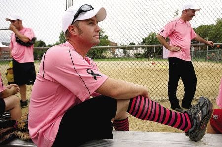 City police faced off against the firefighters in a softball game to benefit Portsmouth firefighter Sarah Fox, who is battling cancer, at the Alumni Field in Portsmouth on Sunday. Pictured is Portsmouth firefighter Brian Wade.