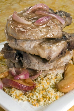 AP Photo 
 
Peaches and pork chops make a healthy meal that is a snap to cleanup.