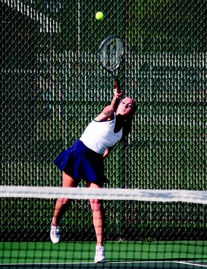 Sarah Beier follows through with a serve during Pontiac’s season-opening tennis match against Bartonville (Limestone) at Williamson Field Monday. Beier is a Dwight student playing for PTHS in a cooperative between the two schools.