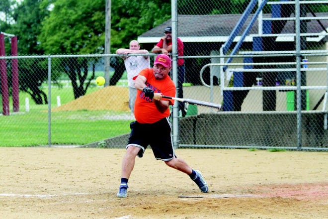 Scott Woods swings at a pitch during the YMCA tournament Sunday.