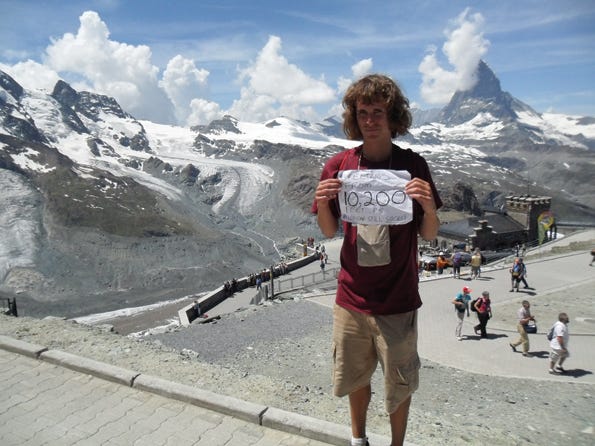 Andy Harris in front of the Gornergrat Mountain in Pennine Alps, Switzerland during his European trip.