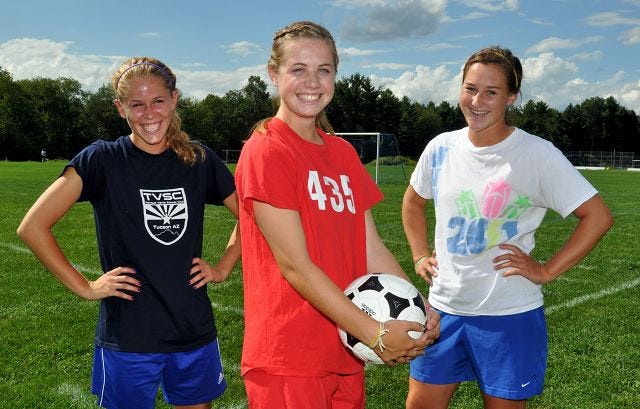 Mike Whaley/Democrat photo
St. Thomas Aquinas girls soccer captains include, from left, Cara Richard, Michaela Cowgill and Jill MacDonald. The Saints won the 2009 Class I title and are gunning for the Division II titile this fall.