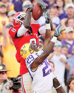 Georgia's A.J. Green (8) makes a catch for a touchdown over LSU's Chris Hawkins during an Oct. 3, 2009, game in Athens, Ga. AP Photo