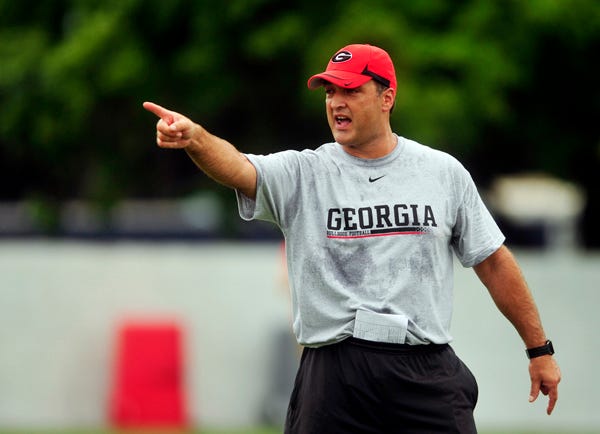 Georgia defensive backs coach Scott Lakatos instructs players as Georgia holds its first football practice on Monday, August 2, 2010 in Athens, Ga. (David Manning/Staff/david.manning@onlineathens.com)