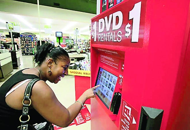 Redbox machines rent DVDs for $1 a night. AP file photo