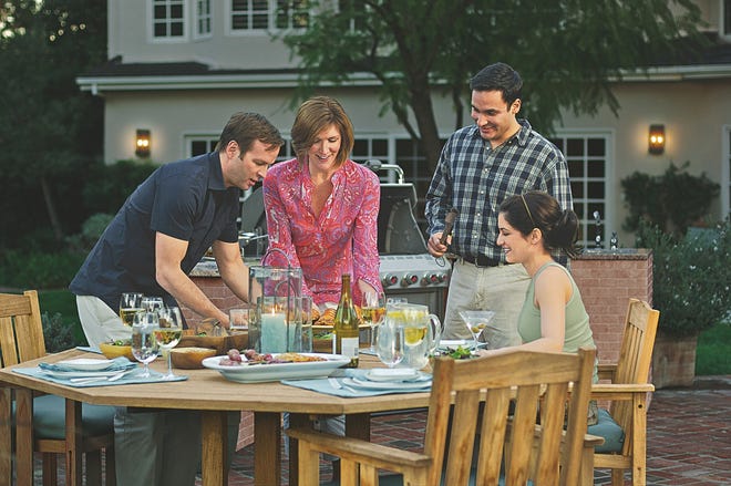 As more Americans try to save money by eating out less and cooking home 
more, smart women are handing their men the barbecue tongs more often. PHOTO 
PROVIDED BY MARNI JAMESON / WEBER-STEPHEN PRODUCTS CO.