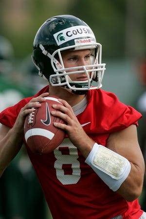Michigan State quarterback Kirk Cousins runs a drill during an NCAA college football practice Tuesday, Aug. 10, 2010, in East Lansing, Mich. Coach Mark Dantonio likes the fact that his players are openly talking about ending the school's Big Ten title drought and finally getting back to the Rose Bowl. (AP Photo/Al Goldis)