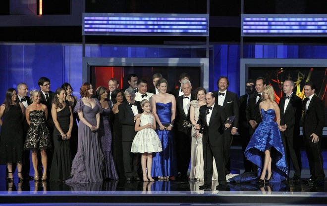 Producer Matthew Weiner, center right, accepts the award for outstanding drama series for "Mad Men" on Sunday during the 62nd Primetime Emmy Awards in Los Angeles.