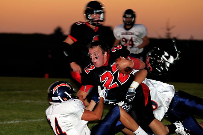 After catching a pass early in the first quarter, Orion halfback Zach Kahley loses his helmet on Friday, Aug. 27.