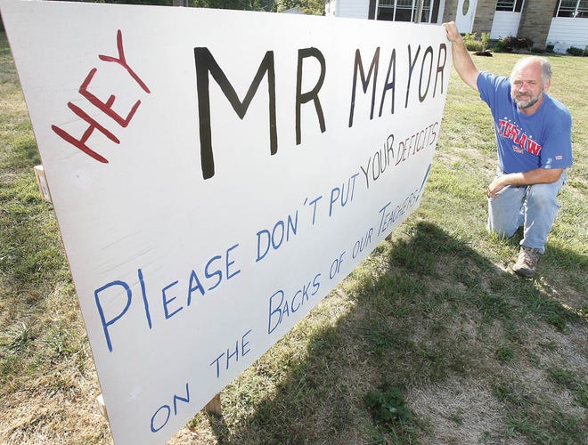 Bruce Knupp has a message for Massillon Mayor Frank Cicchinelli regarding plans to annex land that includes the Tuslaw Local School District property. He posted that message on a 4-foot by 8-foot sign in his Tuscarawas Township yard.