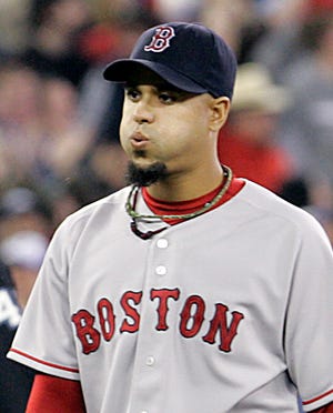 Red Sox reliever Many Delcarmen was traded to the Colorado Rockies on Tuesday.