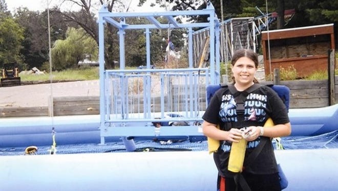 Teagan Marti, 12, was injured after plunging 100 feet to the ground on a theme park ride in Madison, Wis., on July 30. In this picture, she is about to board the ride. Photo courtesy of The American Family Children's Hospital.