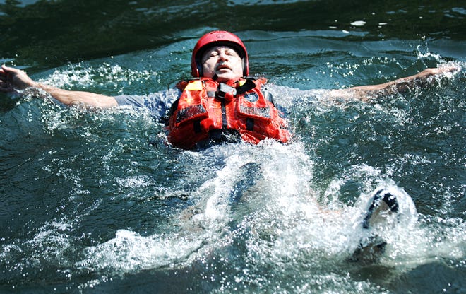 Ricky Dempsey of Georgia's DNR Wildlife Resources, participates in a drill during specialized training in swift water rescue and safety tactics at Savannah Rapids Pavilion on Wednesday. Participants also learned survival skills.