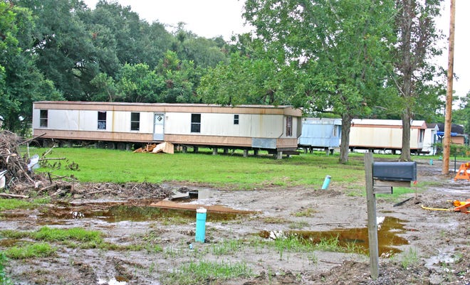 CONTROVERSIAL PARKING...Iberville Parish Councilman Salaris Butler of Seymourville is questioning why the parish is providing sewer service to three trailers recently relocated to Castro Street. The parish has not issued permits for the trailers, which Butler considers the equivalent of a trailer park.