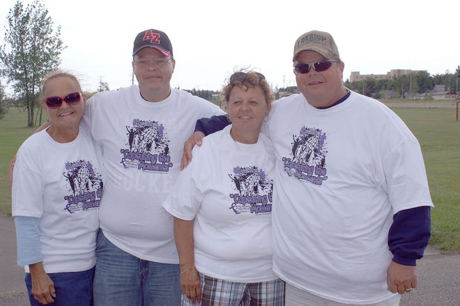 Who participated in the first Devils Lake 5K walk/run for Alzheimer’s? Families who have someone affected by Alzheimer’s like the four pictured here.