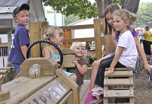 Something kids enjoy every year at the Chippewa County Fair:?The big wooden train. It’s hard to resist climbing on the structure with friends. Pictured, from left to right, are: Joey Derkowski, age 5, of Grand Rapids; Augusta Smith, age 4, of Dafter; Adeline Smith, age 2, of Dafter; Kayla Carson, age 8, of Soo, Ontario; and Hailee Wilson, age 4, of Dafter.