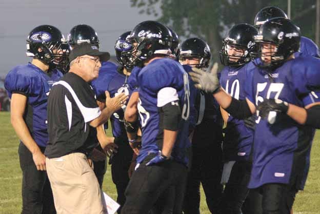 Former Wethersfield coach and current Mid-County coach Tom Buck, pictured talking to his Cougars during last week’s 26-12 win over Princeville, visits Annawan-Wethersfield tonight.