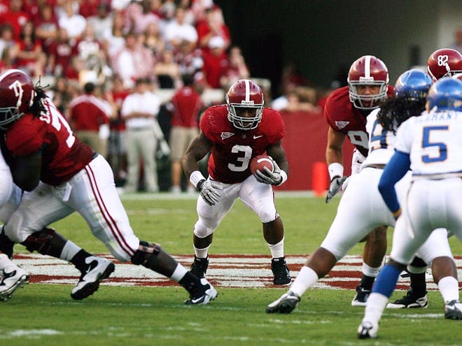 Alabama running back Trent Richardson (3) runs through a hole in the first half against San Jose State at Bryant-Denny Stadium. Richardson rushed for 66 yards and scored two touchdowns.