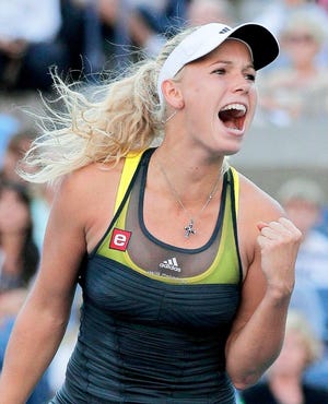 Caroline Wozniacki celebrates during a match at the U.S. Open on Monday against Maria Sharapova. The Associated Press