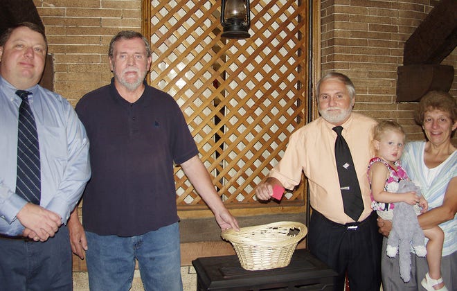 The drawing for the Herkimer County Hunger Coalition raffle was held Tuesday at the Piccolo Restaurant in Little Falls. Pictured, from left, are hunger coalition Director David Petkovsek, hunger coalition Ray Lenarcic and raffle chairs Ron Schoonmaker and Laura Hailston. Also pictured is Hailston’s granddaughter, Lillian Bennett.