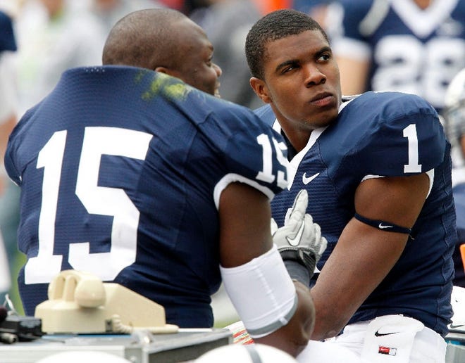 Penn State quarterback Robert Bolden (1) and teammate Bani Gbadyu (15) sit out the fourth quarter of an NCAA college football game against Youngstown State in State College, Pa., Saturday, Sept. 4, 2010. Bolden played three quarters of the 44-14 Penn State win.