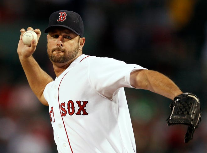 Red Sox starting pitcher Tim Wakefield delivers a knuckleball against the Rays during the first inning of Wednesday's game at Fenway Park in Boston.