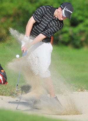 Taunton High's Jarett Leonard hits out of a sand trap on the sixth hole during Wednesday's match against Durfee at Segregansett Country Club in Taunton.