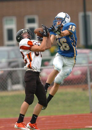 Plainfield's Mason Delorge, left, intercepts a pass intended for Bacon's Connar Chicoski, right, during a football jamboree at Montville High School Friday, September 10, 2010.