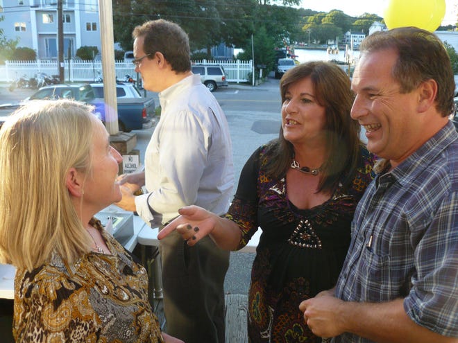 Former classmates Lesley De Labry, left, Paula Baudner and Dan Stanavage catch up during the Bacon Academy class of 1978 50th birthday party Saturday, Sept. 11, 2010 in Mystic.