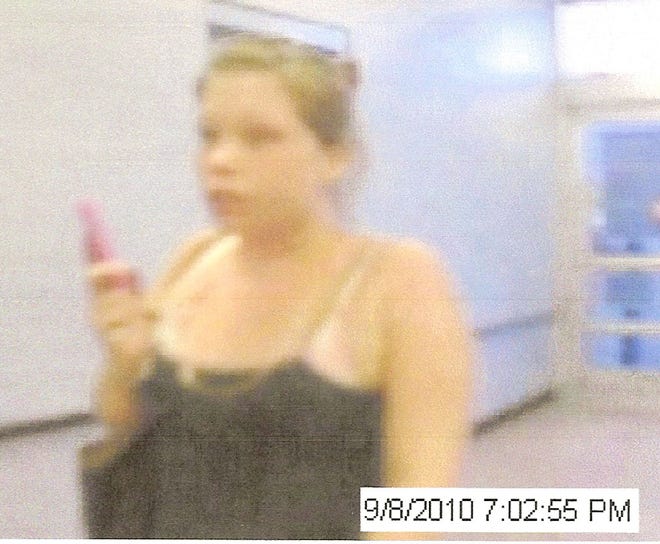 A Walmart surveillance image from Wednesday shows a woman identified as a suspect in a recent string of crimes involving vehicle break-ins and credit card fraud.