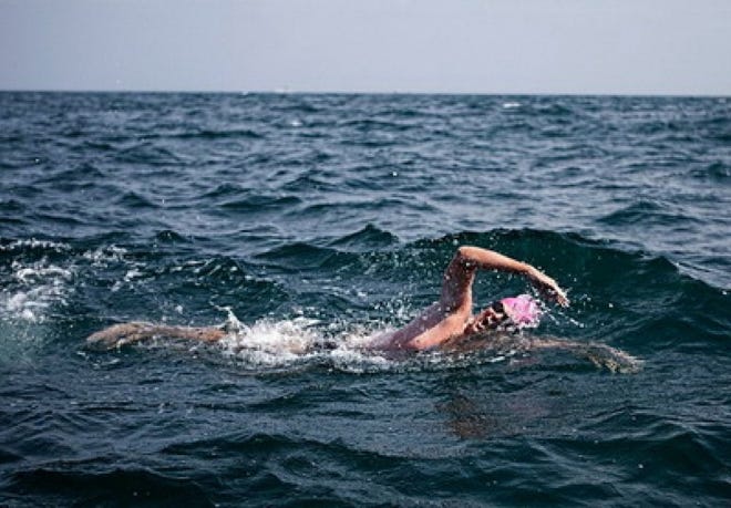 Nearing the end of his 14-hour, one-minute swim across the English Channel, C. Scott Ragsdale, 39, continues toward the French coastline Sept. 2.