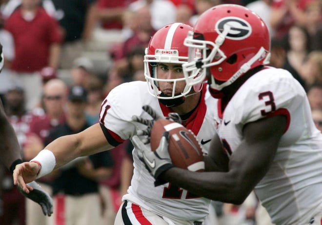 Georgia quarterback Aaron Murray hands the ball off to running back Washaun Ealey (3) during Saturday's game against South Carolina. The Bulldogs had trouble running the ball against the Gamecocks, due in large part to an ineffective offensive line.