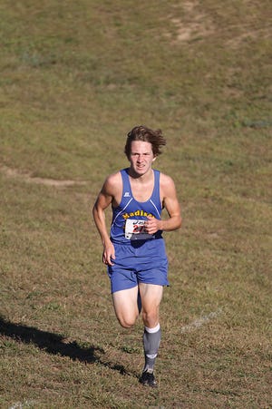 Corey Weitenhagen, above, helped the Madison High School boys cross country team finish second at Tuesday’s TCC?Jamboree. Weitenhagen placed fourth overall in the boys race.