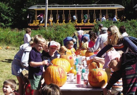 On their stop at the pumpkin patch, guests at Seashore Trolley Museum's Pumpkin Patch Trolley event decorate their finds. This year the musuem will again offer the same opportunity on Sept. 25-26 and Oct. 2-3.