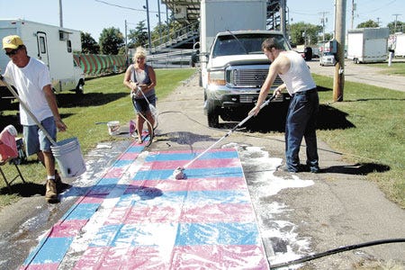 On Monday, game vendors and about 120 employees from Mid-America Entertainment moved rides and equipment into the St. Joseph County fairgrounds in Centreville, in preparation for Sunday’s opening of the St. Joseph County Grange Fair. One item on many to-do lists was cleaning tarps and banners. “Changes are happening at the fairgrounds every day as we get closer to the opening day,”?fair manager Bill Johnson said.