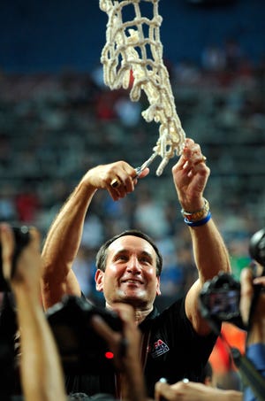 Mike Krzyzewski cut down the nets often this year. Duke won the national title in March and he helped lead the Americans to the world championship.
