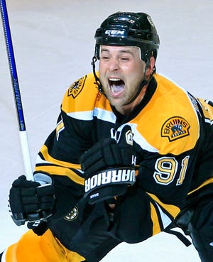 Marc Savard reacts after scoring the game-winning goal against the Flyers on Saturday.