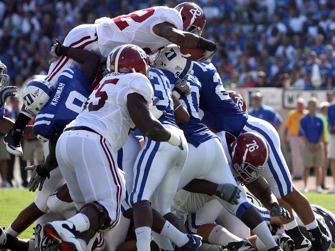Alabama running back Mark Ingram (22) jumps over the line of scrimmage for a touchdown during the first quarter of the Tide's 62-13 win over Duke Saturday in Durham.