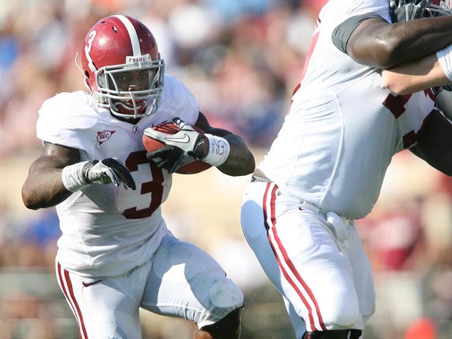 Alabama running back Trent Richardson (3) moves the ball upfield for yardage behind left tackle James Carpenter during the first quarter Saturday. The Crimson Tide finished with 315 yards rushing in the game.