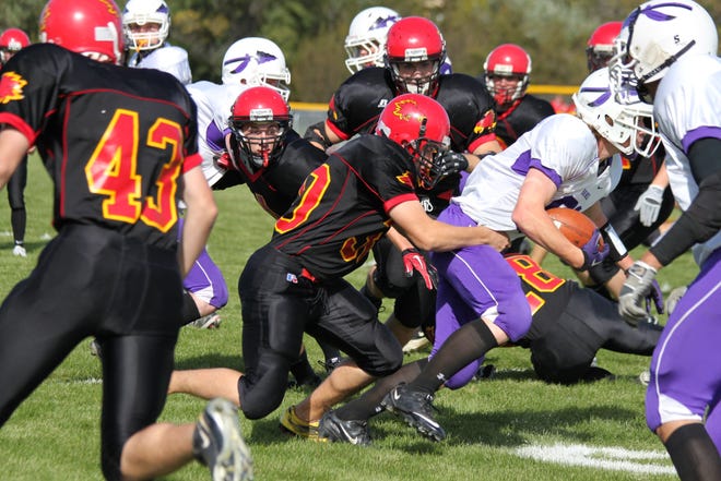 Devils Lake’s Rielly Morken (30) wraps up a Bottineau ball carrier for little gain during Saturday’s homecoming game at Roller Field. The Firebirds scored 28 points in the first quarter on their way to a convincing 48-6 win over the Braves to improve to 4-0 on the season.