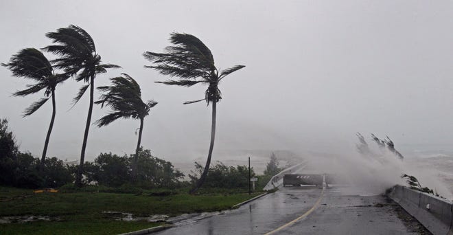High Winds pushes water over the closed causeway leading to Wade International Airport as Hurricane Igor moves ashore in Bermuda, Sunday, Sept. 19, 2010. (AP Photo/Gerry Broome)