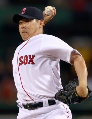 Boston Red Sox pitcher Daisuke Matsuzaka throws to the Baltimore Orioles during the first inning of a baseball game at Fenway Park in Boston, Monday, Sept. 20, 2010.