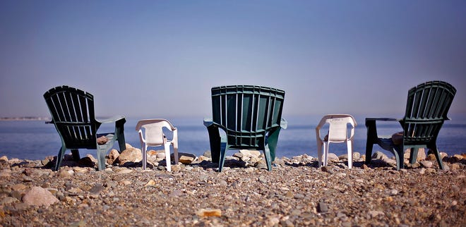 Chairs arraigned for a good view of the beach on Lighthouse Road in Scituate on Monday, Sept. 20, 2010.