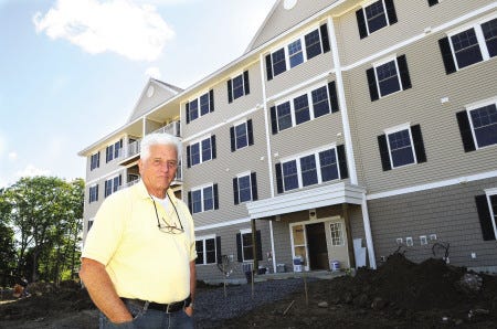 Builder, Robert Felder stands outside the first part of a 120-unit condominium complex with a mix of work-force and senior housing. The project starts here with addtional buildings to go up on the property in Exeter.