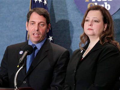 Audience members record video as Tea Party Patriots National founders and coordinators Mark Meckler, left, and Jenny Beth Martin take part in a news conference at the National Press Club in Washington, Tuesday, Sept. 21, 2010, to announce that the organization received a major donation.