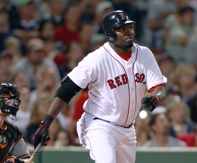 Red Sox designated hitter David Ortiz watches the flight of his three-run home run against the Orioles during the fourth inning of Wednesday's game at Fenway Park in Boston.