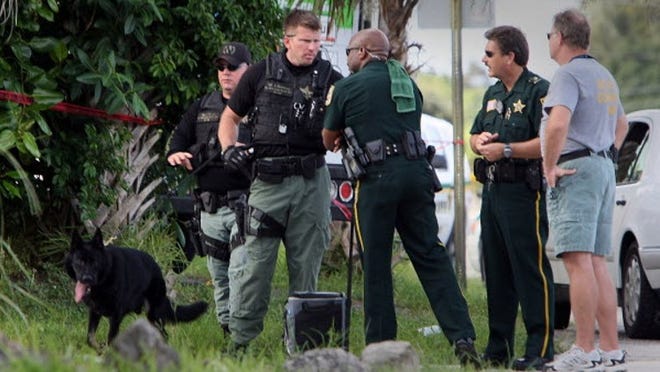PBSO canine units searched the Florida Mango Road neighborhood north of Summit Boulevard for murder suspect Aniel Escobar. Escobar, 33, is wanted in connection with the murder of Arisley Rojas.